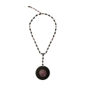 EBONY AND RUBY NECKLACE MOUNTED IN GOLD.